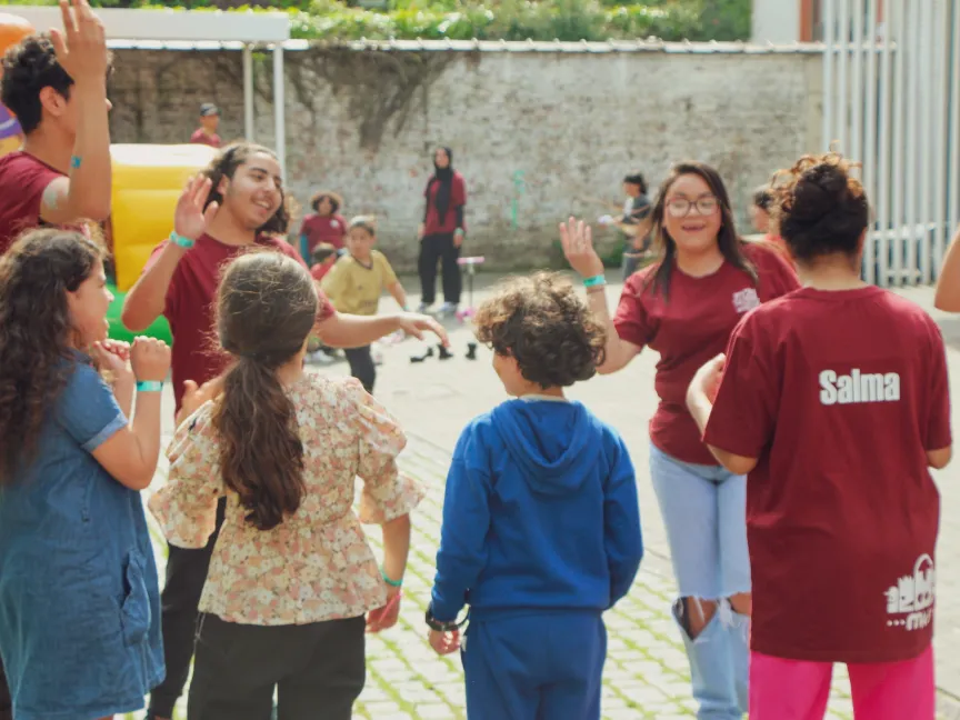 laughing, dancing group of children & teens